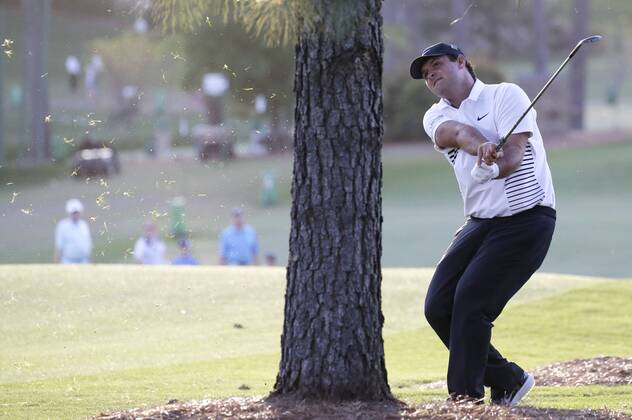 Patrick Reed hits his approach shot to the 17th green in the 2nd round of the 2018 Masters Tournament at the Augusta National Golf Club in Augusta, Georgia, on April 6, 2018.  AUG20180406159 JOHNxANGELILLO