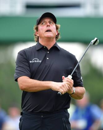 Phil Mickelson reacts after missing a putt on the 17th green during the third round of the 2018 Masters Tournament at the Augusta National Golf Club in Augusta, Georgia, on April 7, 2018.  AUG20180407316 KEVINxDIETSCH