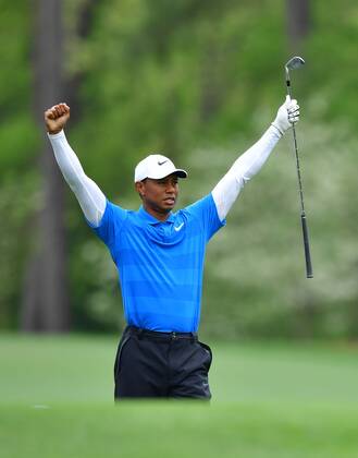 Tiger Woods reacts after hitting off the 11th tee during the third round of the 2018 Masters Tournament at the Augusta National Golf Club in Augusta, Georgia, on April 7, 2018.  AUG20180407310 KEVINxDIETSCH