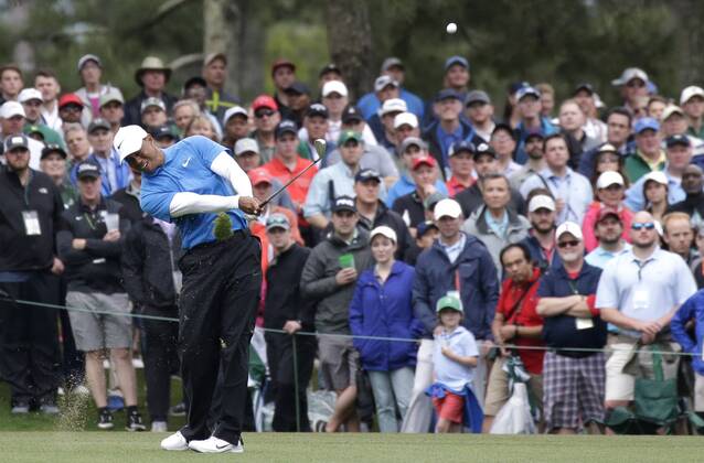 Tiger Woods hits his approach shot to hole 15in the 3rd round of the 2018 Masters Tournament at the Augusta National Golf Club in Augusta, Georgia, on April 7, 2018.  AUG20180407113 JOHNxANGELILLO