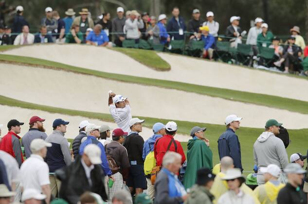 Golf: Masters Tournament 3rd round Hideki Matsuyama (C) of Japan hits a tee shot on the third hole of the third round of the Masters Tournament in Augusta, Georgia, on April 7, 2018.