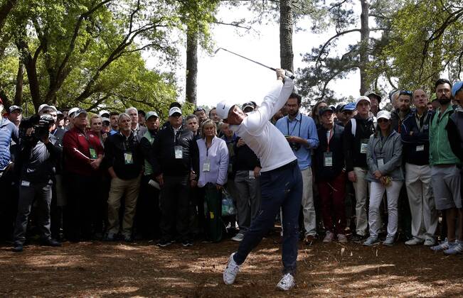 Rory McIlroy hits his approach shot from the rough to the 1st hole in the final round of the 2018 Masters Tournament at the Augusta National Golf Club in Augusta, Georgia, on April 8, 2018.  AUG20180408110 JOHNxANGELILLO