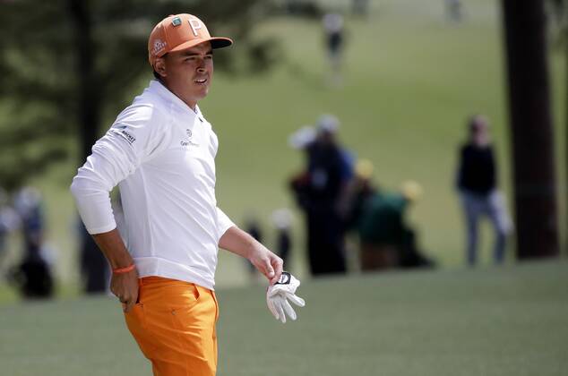 Rickie Fowler walks on the first hole fairway in the final round of the 2018 Masters Tournament at the Augusta National Golf Club in Augusta, Georgia, on April 8, 2018.  AUG20180408113 JOHNxANGELILLO
