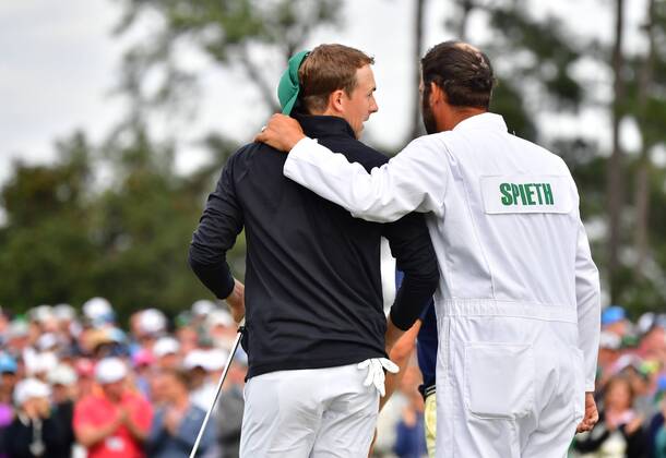 Jordan Spieth and his caddie Michael Greller walk off 18th green after finishing his final round during the 2018 Masters Tournament at the Augusta National Golf Club in Augusta, Georgia, on April 8, 2018.  AUG20180408342 KEVINxDIETSCH