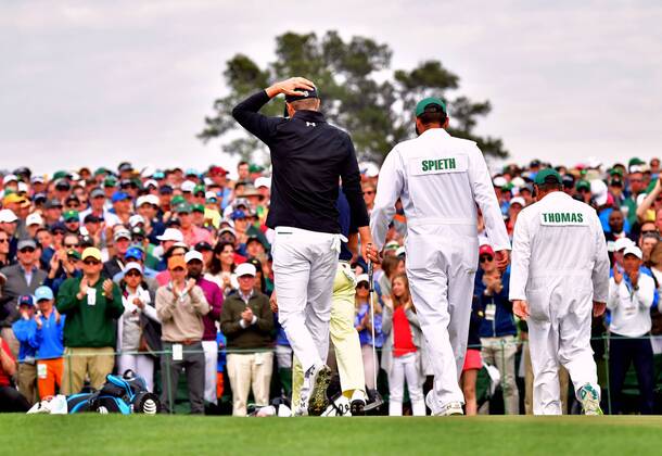Jordan Spieth and his caddie Michael Greller walk off 18th green after finishing his final round during the 2018 Masters Tournament at the Augusta National Golf Club in Augusta, Georgia, on April 8, 2018.  AUG20180408343 KEVINxDIETSCH