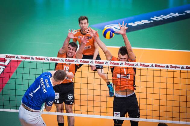 Friedrichshafen Germany 26 04 2018 Bartlomiej Boladz Friedrichshafen 1 against the block from Pierre Pujol BR Volleys 18 and Aleksandar Okolic BR Volleys 1 in the Playoff Final Game 1 of the Volleyball Bundesliga between VfB Friedrichshafen and the Berlin Recycling Volleys