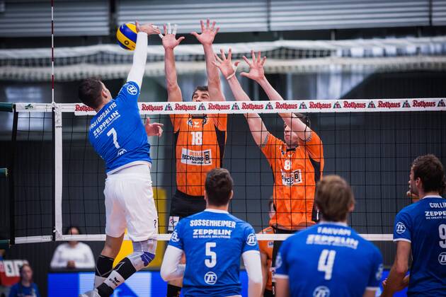 Friedrichshafen Germany 26 04 2018 Athanasios Protopsaltis Friedrichshafen 7 against the block from Pierre Pujol BR Volleys 18 and Graham Vigrass BR Volleys 8 in the Playoff Final Game 1 of the Volleyball Bundesliga between VfB Friedrichshafen and the Berlin Recycling Volleys
