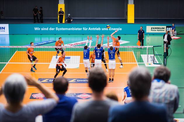 Friedrichshafen Germany 26 04 2018 Adam White BR Volleys 11 against the block from Athanasios Protopsaltis Friedrichshafen 7 Martin Atanasov Friedrichshafen 8 Bartlomiej Boladz Friedrichshafen 1 at Playoff Final Game 1 of the Volleyball Bundesliga between VfB Friedrichshafen and the Berlin Recycling Volleys