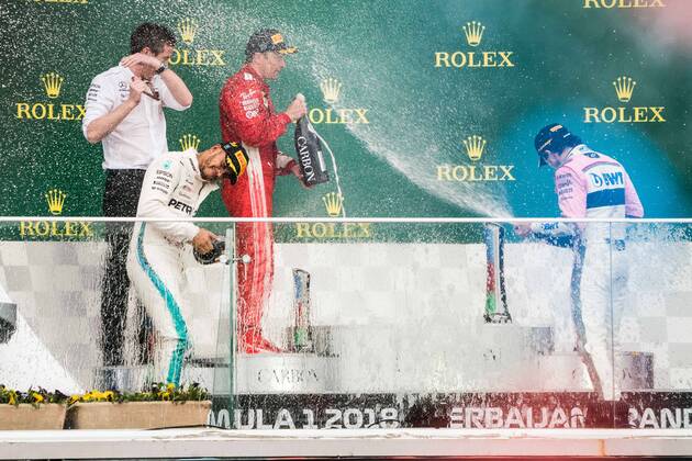 (180429) -- BAKU, April 29, 2018 -- Mercedes Lewis Hamilton (2nd L) of Britain celebrates with Peres of Mexico on the podium during the awarding ceremony for Azerbaijan Formula One Grand Prix in Baku, Azerbaijan, April 29, 2018. ) (SP)AZERBAIJAN-BAKU-F1-AZERBAIJAN GRAND PRIX WuxZhuang 