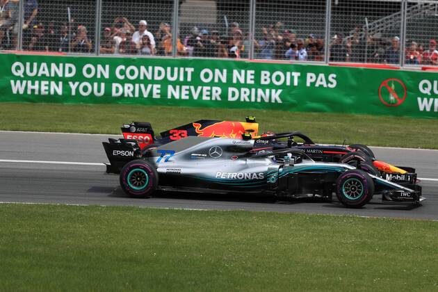 10th June 2018, Circuit Gilles-Villeneuve, Montreal, Canada; Canadian Formula One Grand Prix, race day; Mercedes AMG Petronas Motorsport; Valtteri Bottas and Aston Martin Red Bull Racing TAG Heuer Max Verstappen side by side in first 2 corners  ActionPlus12035539 Octane