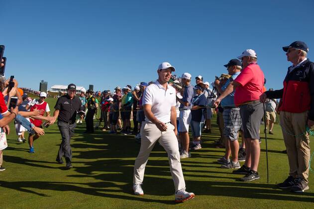 Rory McIlroy from Northern Ireland walks to the 11th tee box with Phil Mickelson behind him in the first round of the 118th U.S. Open Championship at Shinnecock Hills Golf Club in Southampton, New York on June 14, 2018.  NYP20180614115 COREYxSIPKIN