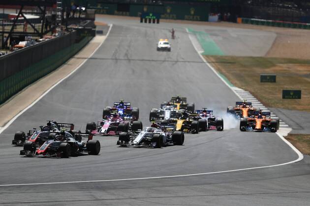 8th July 2018, Silverstone Circuit, Silverstone, England; British Formula One Grand Prix, Race Day; Sahara Force India, Sergio Perez locks up into Turn 1  ActionPlus12045466 Octane