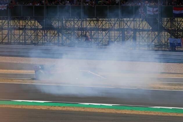 8th July 2018, Silverstone Circuit, Silverstone, England; British Formula One Grand Prix, Race Day; Sahara Force India, Sergio Perez locks up into Turn 1 and demolishes one of the trackside signs  ActionPlus12045475 Octane