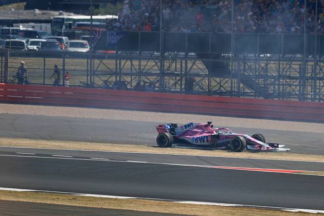 8th July 2018, Silverstone Circuit, Silverstone, England; British Formula One Grand Prix, Race Day; Sahara Force India, Sergio Perez locks up into Turn 1 and demolishes one of the trackside signs  ActionPlus12045476 Octane