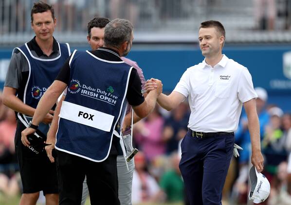 2018 Dubai Duty Free Irish Open, Ballyliffin Golf Club, Co. Donegal 8 7 2018 Ryan Fox s Caddie congratulates Russell Knox on his win Ryan Fox s Caddie congratulates Russell Knox on his win 8 7 2018  Copyright: x©INPHO OisinxKeniryx OSH_8997