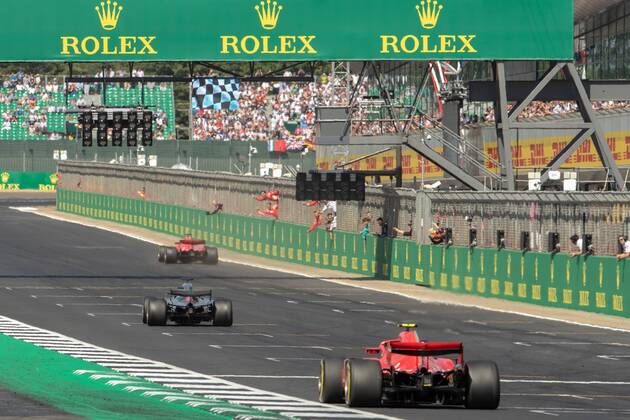 8th July 2018, Silverstone Circuit, Silverstone, England; British Formula One Grand Prix, Race Day; Scuderia Ferrari driver Sebastian Vettel celebrates with his team as Hamilton takes 2nd and Raikkonen 3rd  ActionPlus12045543 TimxWilliams