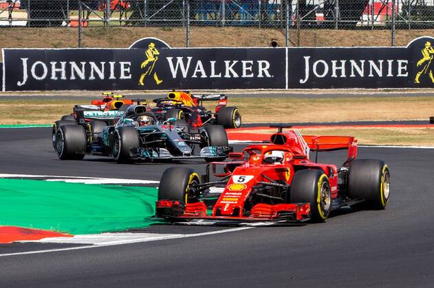 8th July 2018, Silverstone Circuit, Silverstone, England; British Formula One Grand Prix, Race Day; Sebastian Vettel in his Scuderia Ferrari SF71H ahead of Lewis Hamilton in his Mercedes AMG Petronas Motorsport Mercedes F1 W09  ActionPlus12045560 TimxWilliams