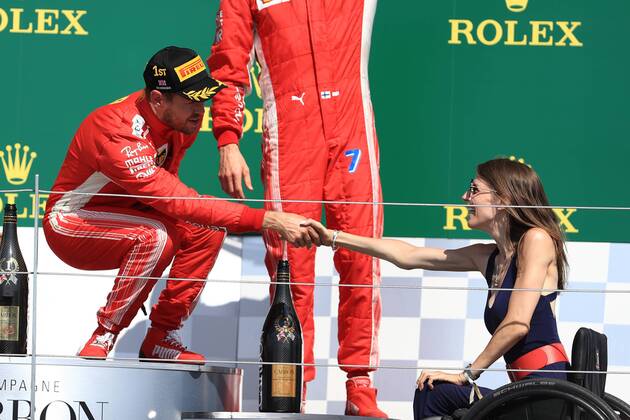 Sport - Bilder des Tages 8th July 2018, Silverstone Circuit, Silverstone, England; British Formula One Grand Prix, Race Day; Sebastian Vettel shakes hands with Porsche driver Nathalie McGloin  ActionPlus12045579 Octane