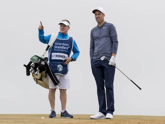 12th July 2018, Gullane Golf Club, Gullane, Scotland; Aberdeen Investments Scottish Open Golf, 1st round; Ross Fisher lines up shot with guidance from his caddy on the 10th fairway  ActionPlus12046727 AlanxRennie