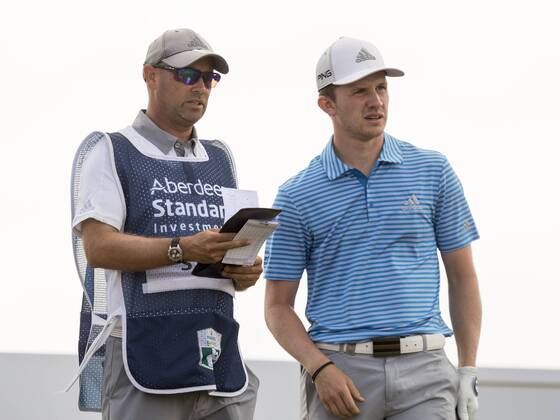 15th July 2018, Gullane Golf Club, Gullane, Scotland; Aberdeen Investments Scottish Open Golf, 4th round; Connor Syme discusses his set up with caddy on the second tee  ActionPlus12047871 AlanxRennie
