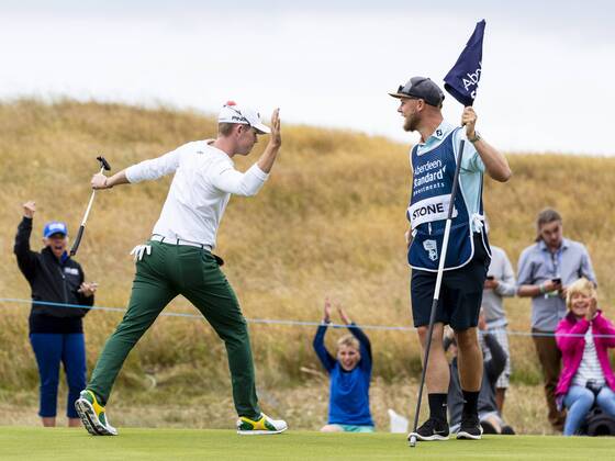 15th July 2018, Gullane Golf Club, Gullane, Scotland; Aberdeen Investments Scottish Open Golf, 4th round; Brandon Stone high five with caddie after eagle putt on the 16th as he headed for a closing round 60  ActionPlus12048145 AlanxRennie