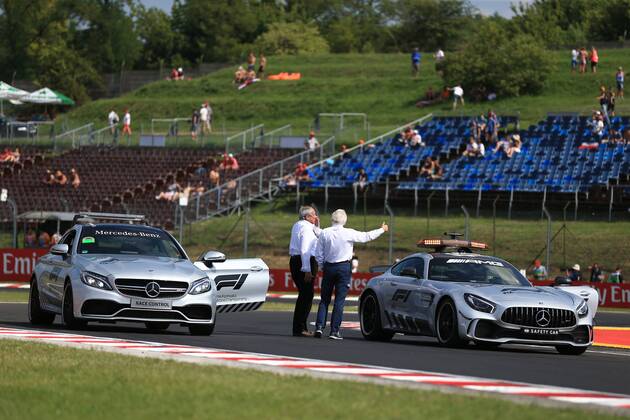 27th July 2018, Hungaroring, Mogyorod, Hungary; Hungarian Formula One Grand Prix, Friday free practice; Charlie Whiting checks the circuit layout  ActionPlus12050787 Octane