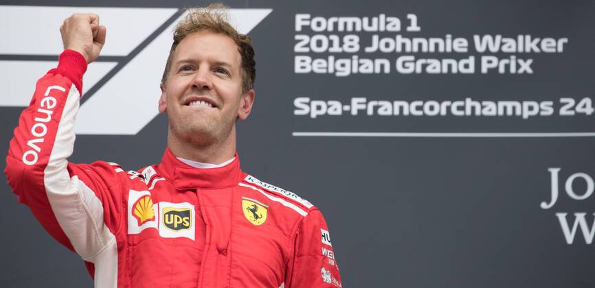 Ferrari s German driver Sebastian Vettel celebrates on the podium after winning the Spa-Francorchamps Formula One Grand Prix of Belgium race, in Spa-Francorchamps, Sunday 26 August 2018. BENOITxDOPPAGNE x05414414x