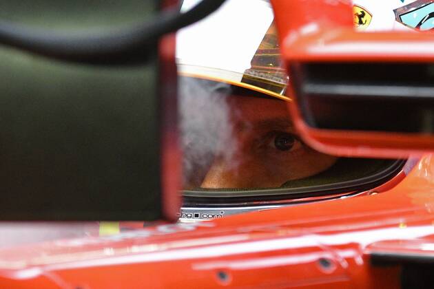 (180915) -- SINGAPORE, Sept. 15, 2018 -- Ferrari driver Sebastian Vettel of Germany looks on in the second practise session of the Formula One Singapore Grand Prix Night Race held at the Marina Bay Street Circuit on Sept. 14, 2018. ) (SP)SINGAPORE-F1 GRAND PRIX NIGHT RACE-PRACTISE ThenxChihxWey
