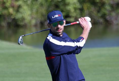 Michael Phelps hits a shot during a Ryder Cup 2018 celebrity tournament at Le Golf National in Guyancourt near Paris on September 25, 2018. The three-day main event Ryder Cup featuring Team USA versus Team Europe starts Friday, September 28th.  PAR20180925106 DAVIDxSILPA
