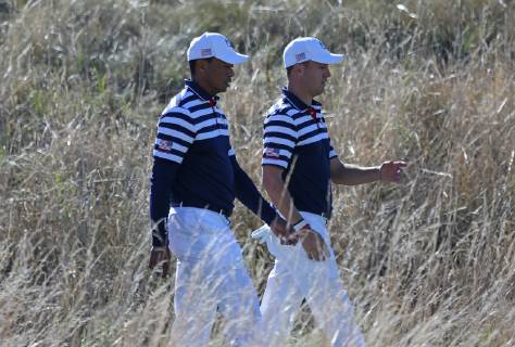 Tiger Woods (L) and Justin Thomas walk to the 14th green during a Ryder Cup 2018 practice session at Le Golf National in Guyancourt near Paris on September 26, 2018. The three-day tournament features Team USA versus Team Europe and starts Friday, September 28th.  PAR20180926062 DAVIDxSILPA