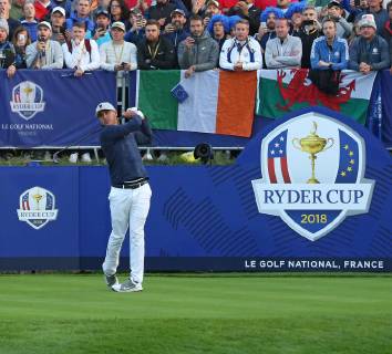 Brooks Koepka hits his opening shot on the first tee at the start of the Ryder Cup at Le Golf National in Guyancourt near Paris on September 28, 2018. Team USA will compete against Team Europe in the three-day tournament.  PAR20180928081 DAVIDxSILPA