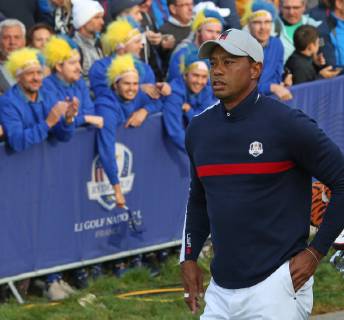 Tiger Woods walks towards the fairway after hitting his opening shot on the first tee at the start of the Ryder Cup at Le Golf National in Guyancourt near Paris on September 28, 2018. Team USA will compete against Team Europe in the three-day tournament.  PAR20180928090 DAVIDxSILPA
