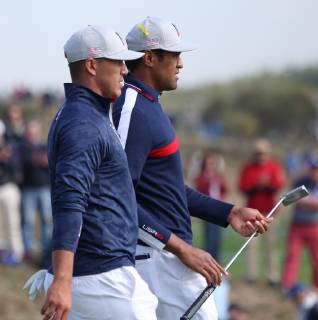 Brooks Koepka (L) and Tony Finau walks between holes on day one of the Ryder Cup at Le Golf National in Guyancourt near Paris on September 28, 2018. Team USA leads Team Europe 3-1 after completion of the opening four-balls.  PAR20180928121 DAVIDxSILPA