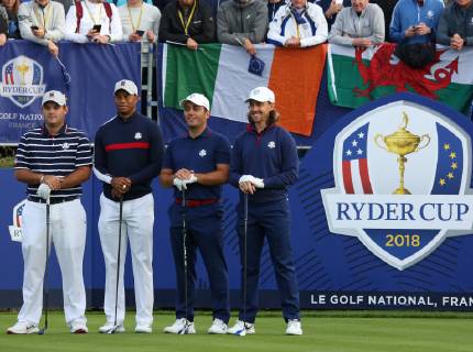 (From L to R) Patrick Reed, Tiger Woods, Francesco Molinari and Tommy Fleetwood arrive on the first tee before the start of the Ryder Cup at Le Golf National in Guyancourt near Paris on September 28, 2018.  PAR20180929108 DAVIDxSILPA