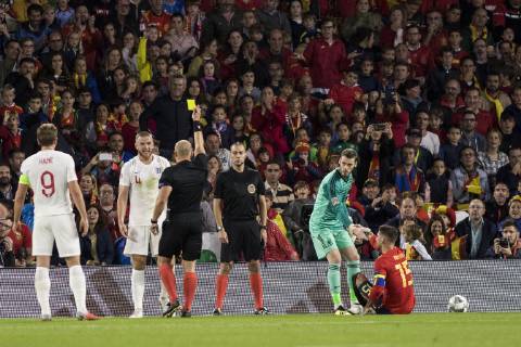 October 15, 2018 - Seville, Spain - ERIC DIER of England (C) receives a yellow card during the UEFA Nations League Group A4 soccer match between Spain and England at the Benito Villamarin Stadium Soccer 2018 - Spain vs England - ZUMAa142 20181015_zap_a142_013 Copyright: xDanielxGonzalezxAcunax