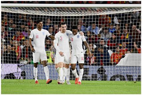 Spain v England UEFA Nations League Raheem Sterling of England (right) celebrates scoring their third goal to make it Spain 0 England 3 during the UEFA Nations League match at the Estadio Benito Villamarin, Seville Content Not Available For UK Newspapers Copyright: xKristianxKanex FIL-12410-0024