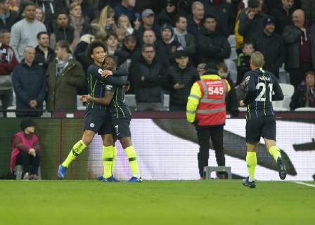 Raheem Sterling of Manchester City celebrates scoring with Leroy San? of Manchester City during the Premier League match between West Ham United and Manchester City at the Olympic Park, London, England on 24 November 2018. Copyright: xVincexxMignottx PMI-2420-0007