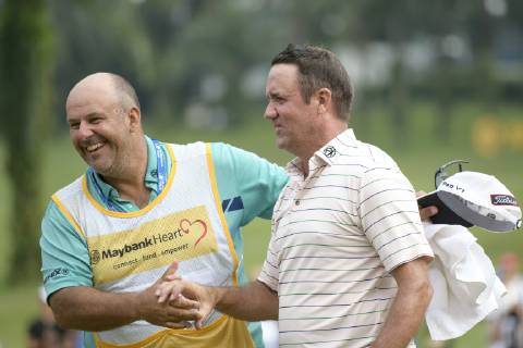 March 24, 2019 - Kuala Lumpur, Malaysia - Scott Hend of Australia celebrates with his caddie after he wins the Maybank Championship 2019 at Saujana Golf and Country Club on March 24, 2019 in Kuala Lumpur, Malaysia. Scott Hend Wins The Maybank Championship 2019  - ZUMAn230 20190324_zaa_n230_118 Copyright: xChrisxJungx