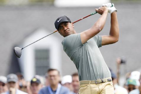 Tony Finau hits a tee shot on the 1st hole at practice on the Tuesday before the 2019 Masters Tournament at Augusta National Golf Club in Augusta, Georgia, on April 9, 2019.  AUG20190409118 JOHNxANGELILLO