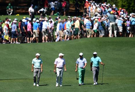 Kevin Kisner Fred Coupes, Zach Johnson and Tiger Woods walk after their tee shots at practice on the Wednesday before the 2019 Masters Tournament at Augusta National Golf Club in Augusta, Georgia, on April 10, 2019.  AUG20190410909 KEVINxDIETSCH