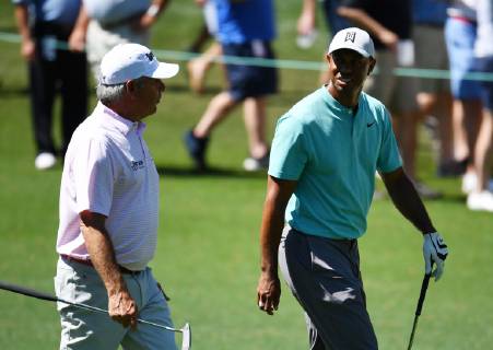 Fred Coupes walks with Tiger Woods after tee shots at practice on the Wednesday before the 2019 Masters Tournament at Augusta National Golf Club in Augusta, Georgia, on April 10, 2019.  AUG20190410911 KEVINxDIETSCH