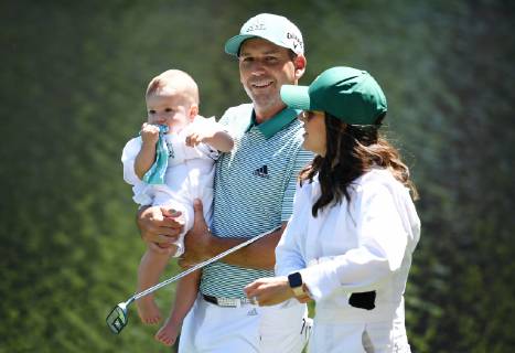 Sergio Garcia of Spain holds daughter Azalea Adele Garcia while walking with Angela Akins Garcia at the Par 3 Contest on the Wednesday before the 2019 Masters Tournament at Augusta National Golf Club in Augusta, Georgia, on April 10, 2019.  AUG20190410914 KEVINxDIETSCH