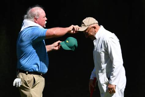 Craig Stadler swaps hats with his caddie at the Par 3 Contest on the Wednesday before the 2019 Masters Tournament at Augusta National Golf Club in Augusta, Georgia, on April 10, 2019.  AUG20190410923 KEVINxDIETSCH