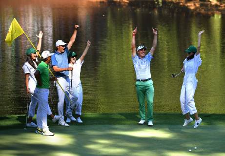Rickie Fowler, fiance Allison Stokke, Jordan Spieth, fiance Annie Verret and Justin Thomas react after Thomas s girlfriend Jillian Wisniewski sinks a putt on the Wednesday before the 2019 Masters Tournament at Augusta National Golf Club in Augusta, Georgia, on April 10, 2019.  AUG20190410928 KEVINxDIETSCH