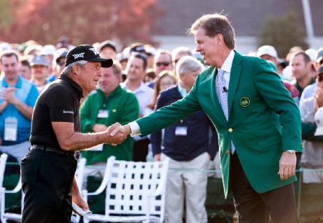 Golf legend Gary Player shakes hands with Chairman of Augusta National Fred Ridley after the ceremonial tee shot to start the Masters Tournament at Augusta National Golf Club in Augusta, Georgia, on April 11, 2019.  AUG20190411308 KEVINxDIETSCH