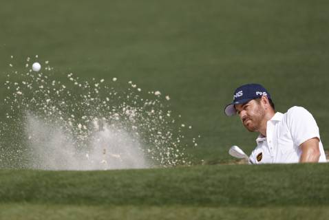 Louis Oosthuizen hits out of a bunker on the 2nd hole in the first round at the 2019 Masters Tournament at Augusta National Golf Club in Augusta, Georgia, on April 11, 2019.  AUG20190411132 JOHNxANGELILLO