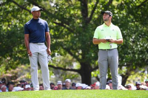 Tiger Woods (L) and Jon Rahm wait to hit off the 4th tee during the first round of the Masters Tournament at Augusta National Golf Club in Augusta, Georgia, on April 11, 2019.  AUG20190411337 KEVINxDIETSCH