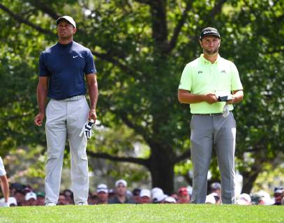 Tiger Woods (L) and Jon Rahm wait to hit off the 4th tee during the first round of the Masters Tournament at Augusta National Golf Club in Augusta, Georgia, on April 11, 2019.  AUG20190411338 KEVINxDIETSCH