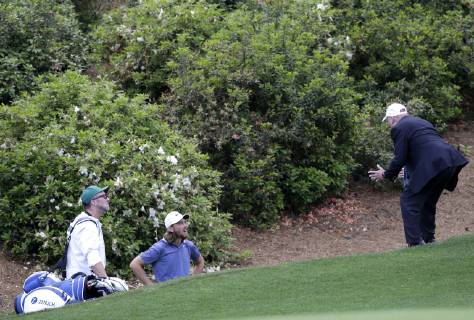 Tommy Fleetwood gets a ruling while standing in the area of Raes Creek on the 13th hole in the first round at the 2019 Masters Tournament at Augusta National Golf Club in Augusta, Georgia, on April 11, 2019.  AUG20190411154 JOHNxANGELILLO
