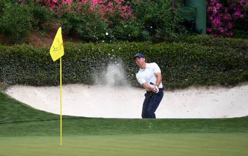 Paul Casey hits from a bunker on the 12th hole during the first round of the Masters Tournament at Augusta National Golf Club in Augusta, Georgia, on April 11, 2019.  AUG20190411368 KEVINxDIETSCH